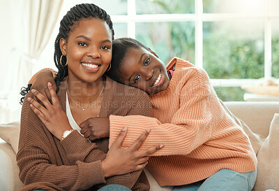 Buy stock photo Shot of a young mother hugging her daughter