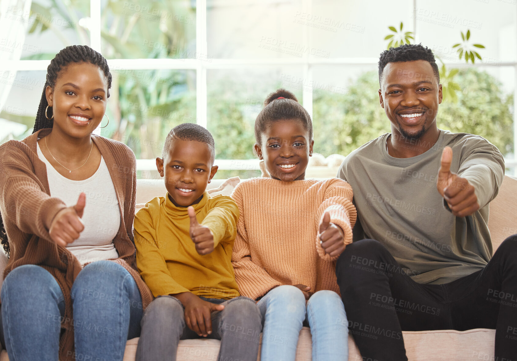Buy stock photo Shot of a family giving the thumbs up together