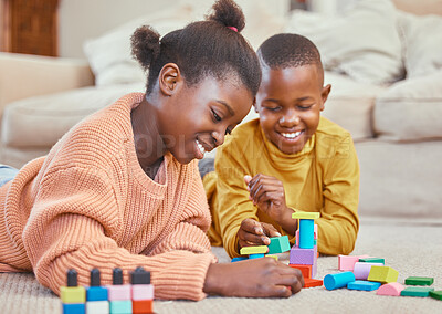 Buy stock photo Shot of a brother and sister playing together