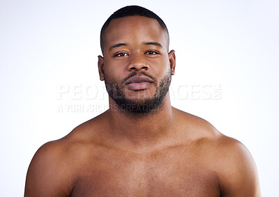 Buy stock photo Studio portrait of a handsome young man posing against a white background