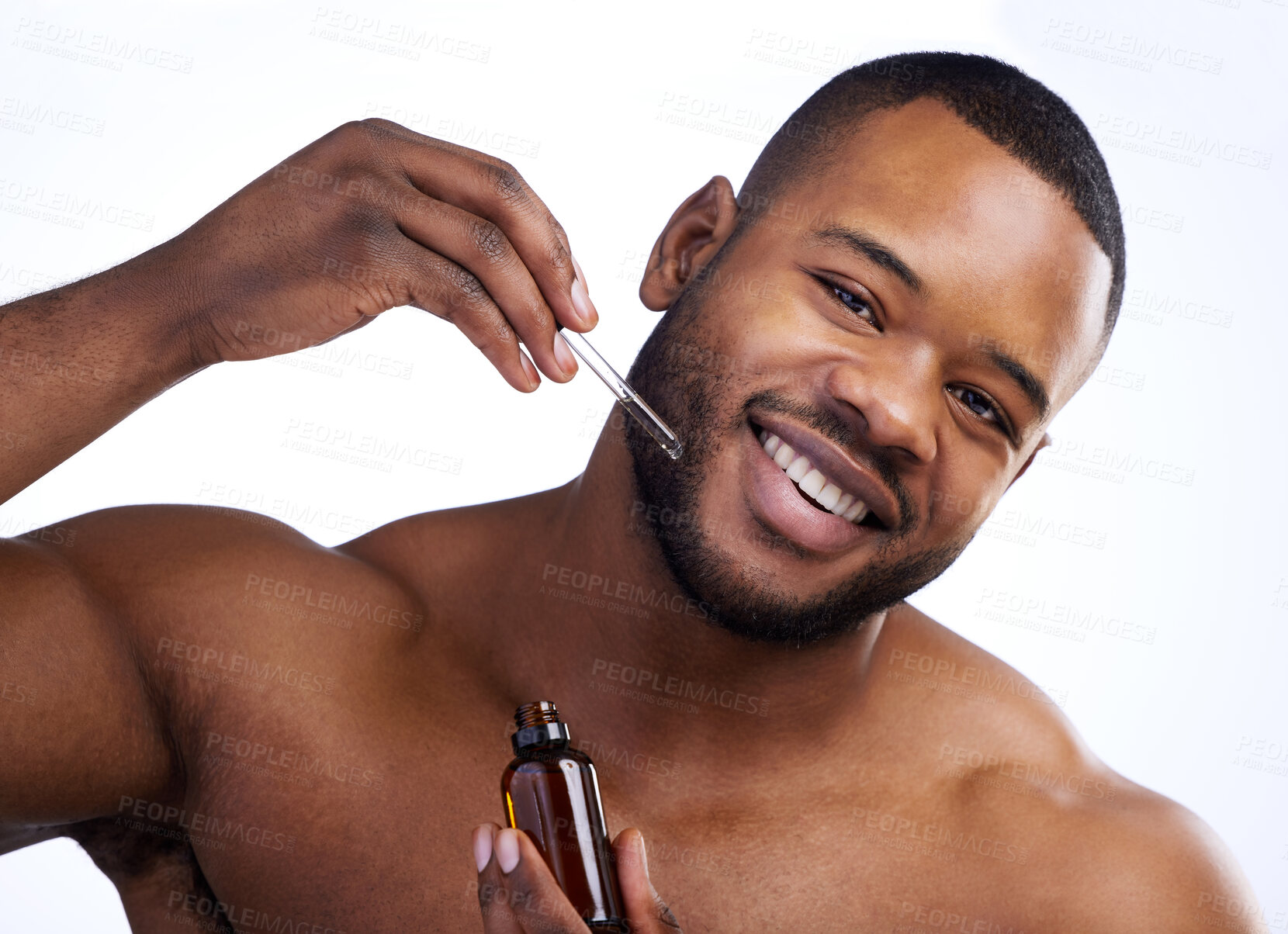 Buy stock photo Black man, skincare and serum in studio for portrait, skin hydration and vitamin C. Treatment, face and happy person on white background for antiaging, dermatology and bottle of facial oil in pipette