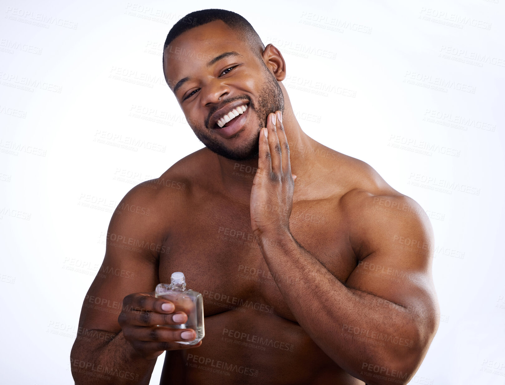 Buy stock photo Happy black man, portrait and bottle with cologne for fresh smell, scent or hygiene on a white studio background. Young African, male person or model smile in perfume, fragrance or after shave