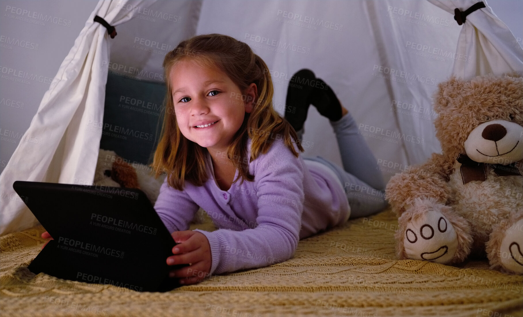 Buy stock photo Tablet, tent and portrait of kid in home playing educational games or online activities for cognitive development. Relax, blanket fort and girl watch movie on app with digital technology in house.