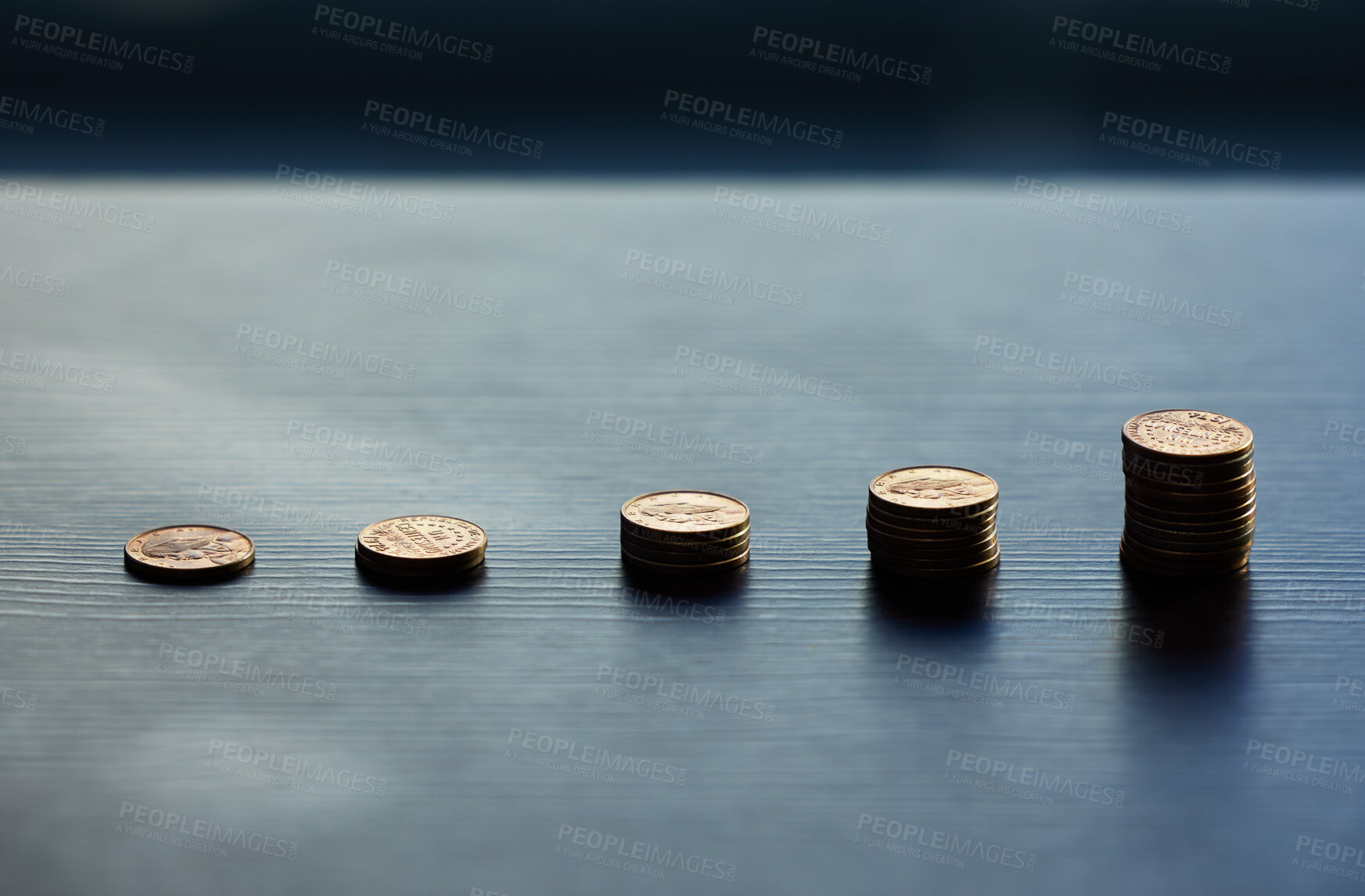 Buy stock photo Shot of a bunch of coins on a table