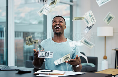Buy stock photo Shot of a young businessman managing his money at home
