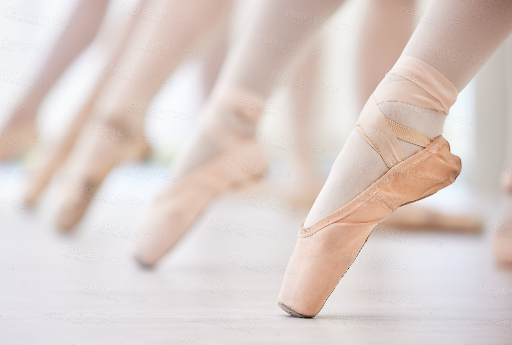Buy stock photo Shot of a group of ballerina's with toes pointed
