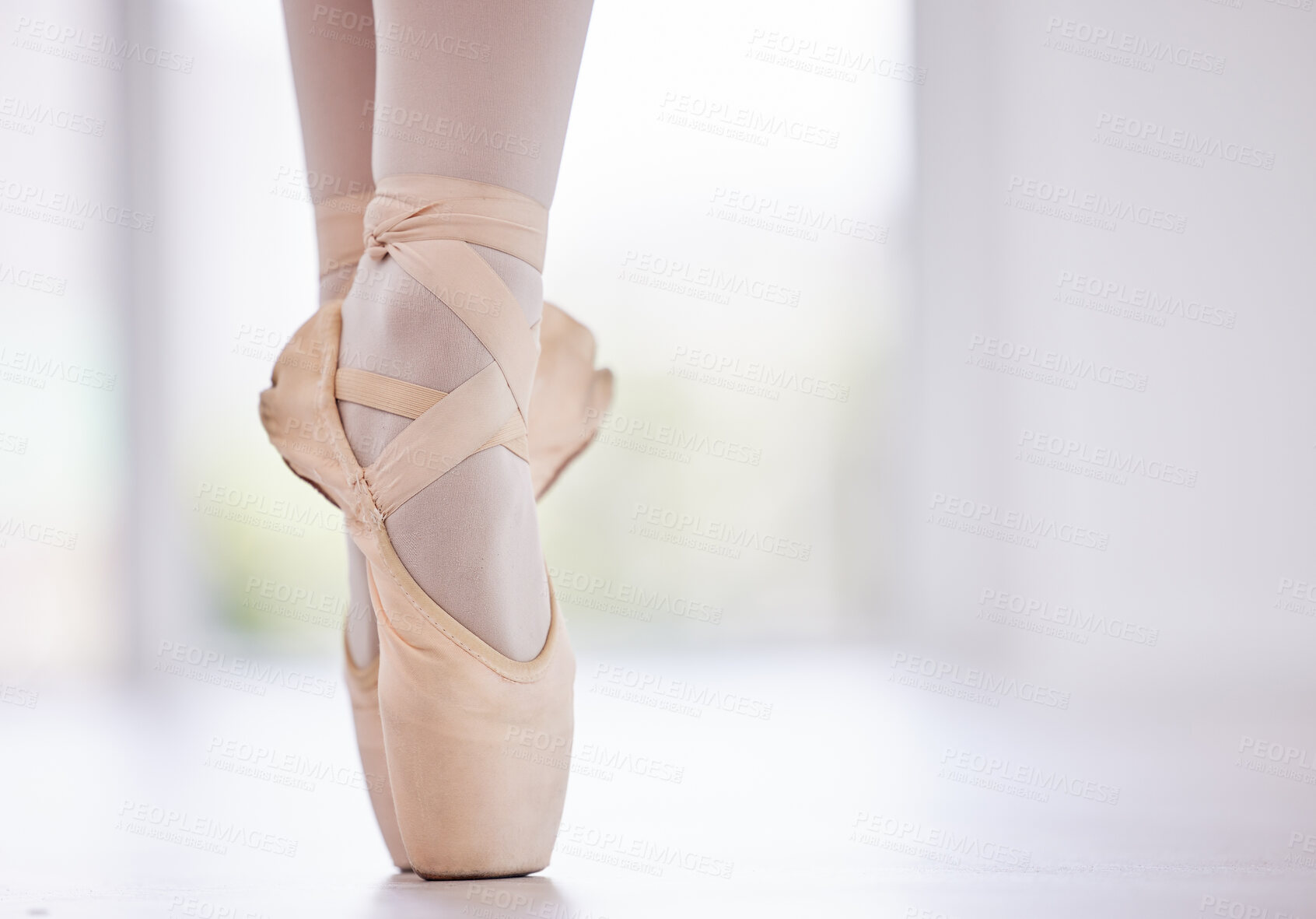 Buy stock photo Person, feet and ballet with balance on toes for dance routine, practice or training on floor at studio. Closeup of dancer, foot or ballerina in pointe or performance for skill, talent or technique