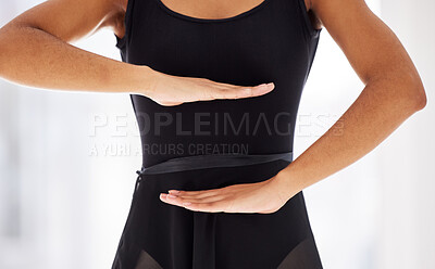 Buy stock photo Shot of a ballerina holding her hands in front of her stomach