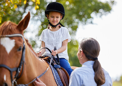Buy stock photo Shot of young girl with her instructor with a horse outdoors in a forest