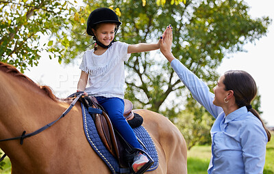 Buy stock photo Shot of young girl with her instructor with a horse outdoors in a forest