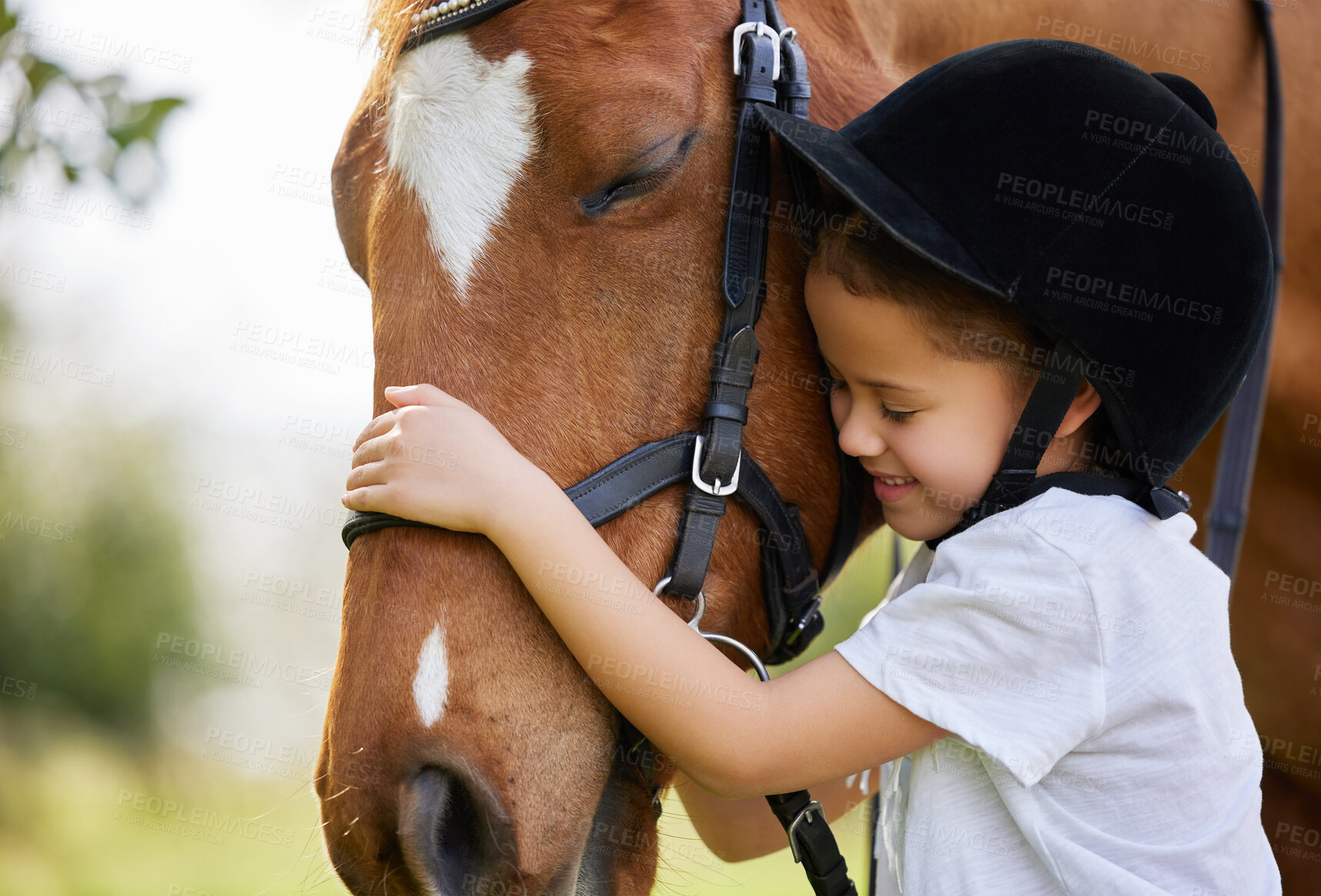 Buy stock photo Shot of a little girl hugging a horse outside