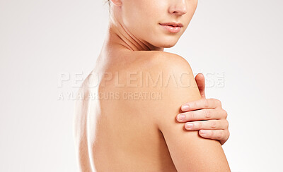 Buy stock photo Woman, shoulder and smooth skin in studio, body treatment and hydration glow for skincare. Female person, soft beauty and cosmetics shine for dermatology, bodycare and clear on white background