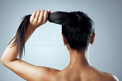 Buy stock photo Studio shot of a young woman with against a grey background