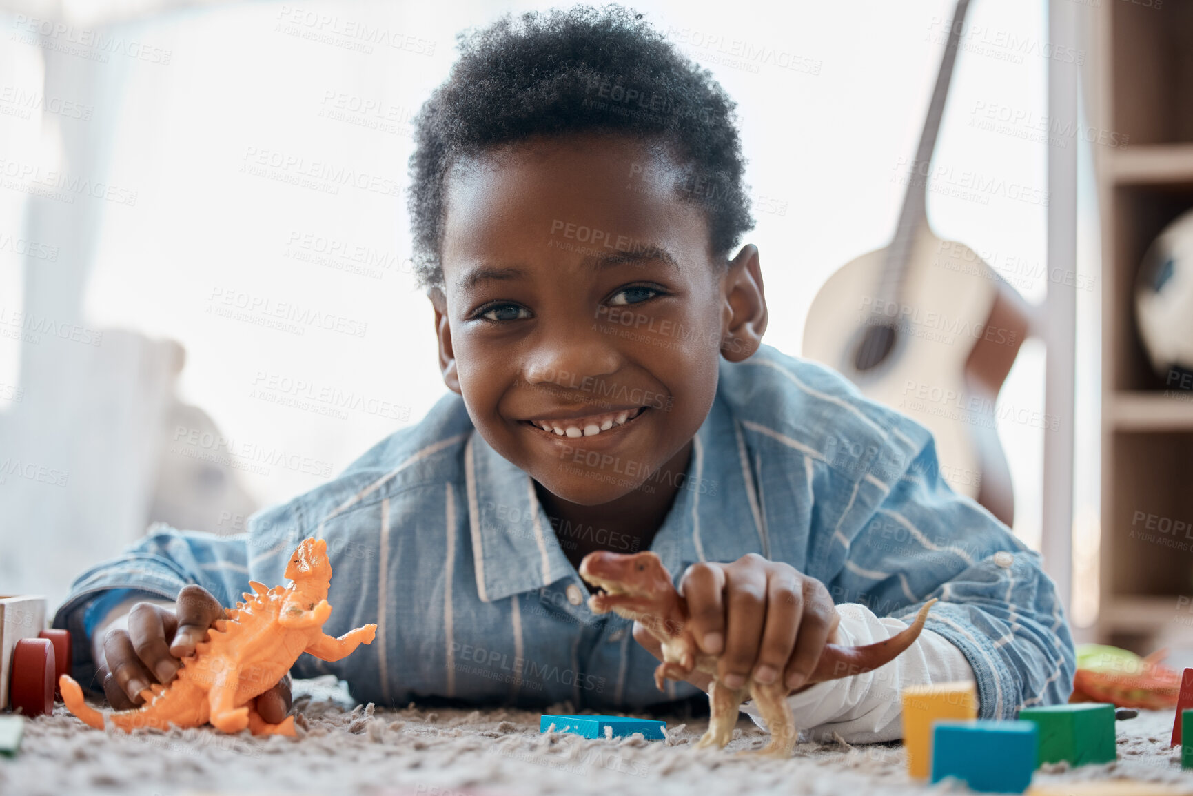 Buy stock photo Boy, home and happy with toys in portrait on floor for fun, relax and break for child development. Bedroom, kid and smile with plastic dinosaur for playing games and chill for childhood memories