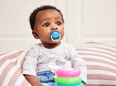 Buy stock photo Shot of a little baby sitting on a bed