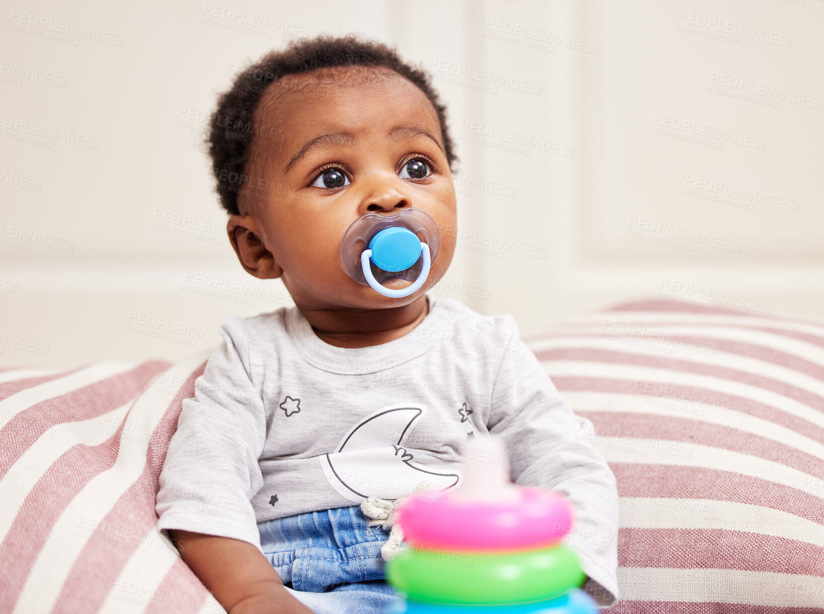 Buy stock photo Shot of a little baby sitting on a bed