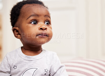 Buy stock photo Shot of a little baby sitting on a bed