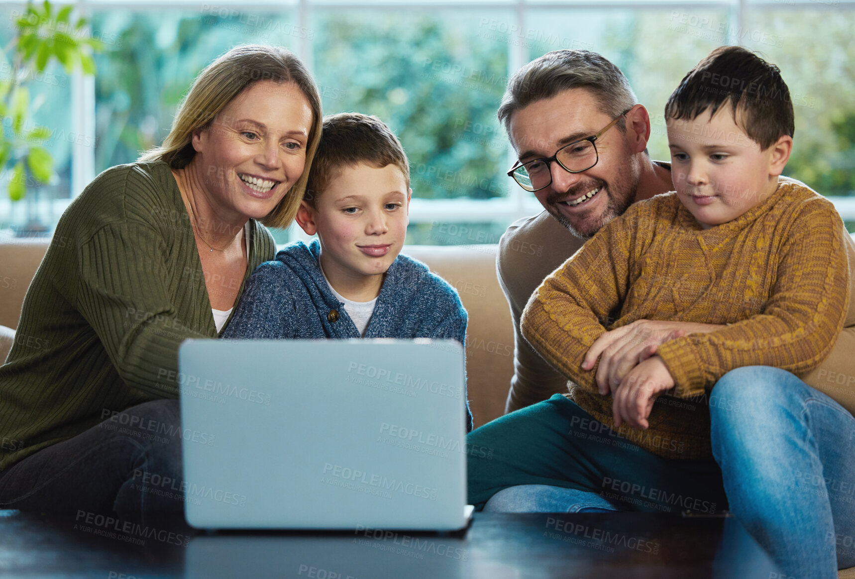 Buy stock photo Family, laptop and streaming movie in home together, bonding and online subscription for series. Parents, children and relax in living room on weekend, love and happiness while watching film on app