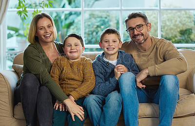 Buy stock photo Shot of a family relaxing together in the living room