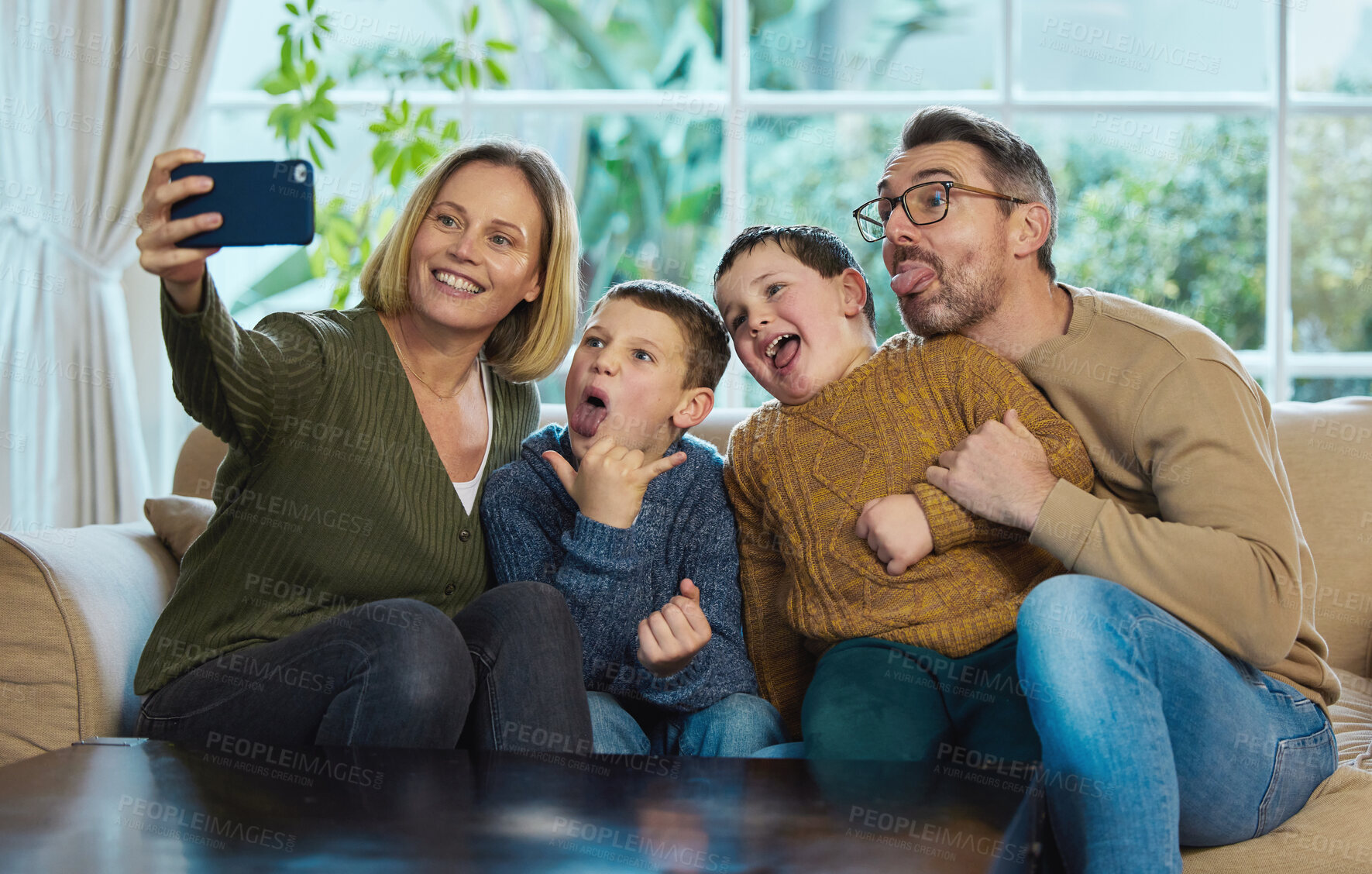 Buy stock photo Selfie, parents and children with happiness in living room for photography, memory or social media. Family, kids and woman with man for profile picture, playful or bonding in home with funny face