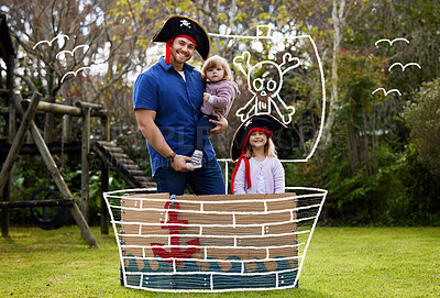 Buy stock photo Shot of a father and daughters dressed up like pirates outside in the yard