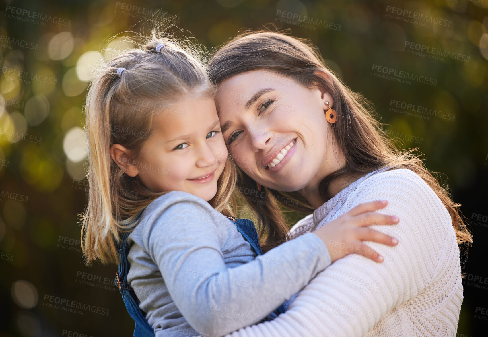 Buy stock photo Portrait of a mother and her little daughter bonding together outdoors