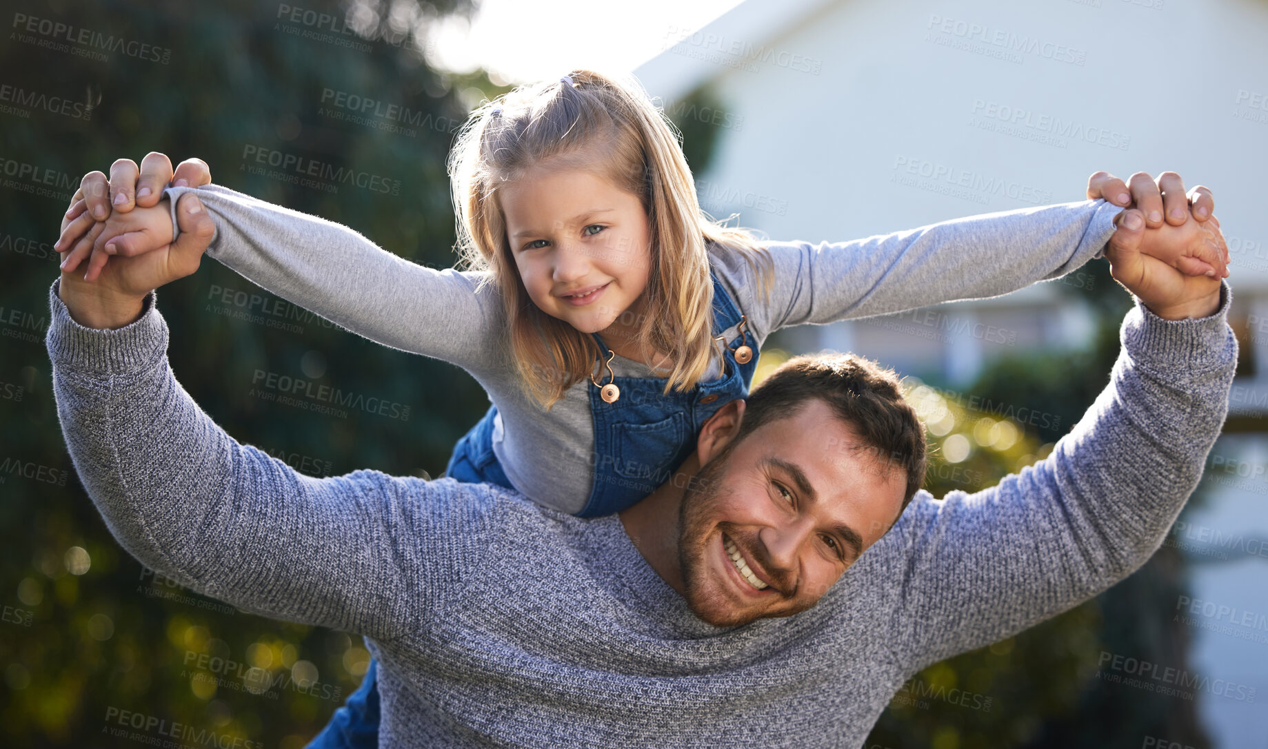 Buy stock photo Portrait of a little girl having fun with her father outdoors