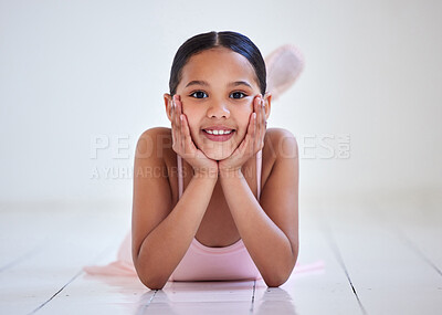 Buy stock photo Portrait of a little girl lying on the floor in a ballet studio