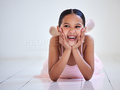 Buy stock photo Shot of a little girl lying on the floor in a ballet studio