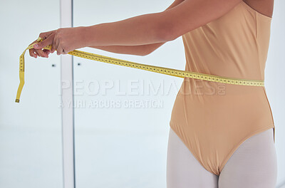 Buy stock photo Shot of an unrecognizable ballet dancer measuring her waist during a rehearsal