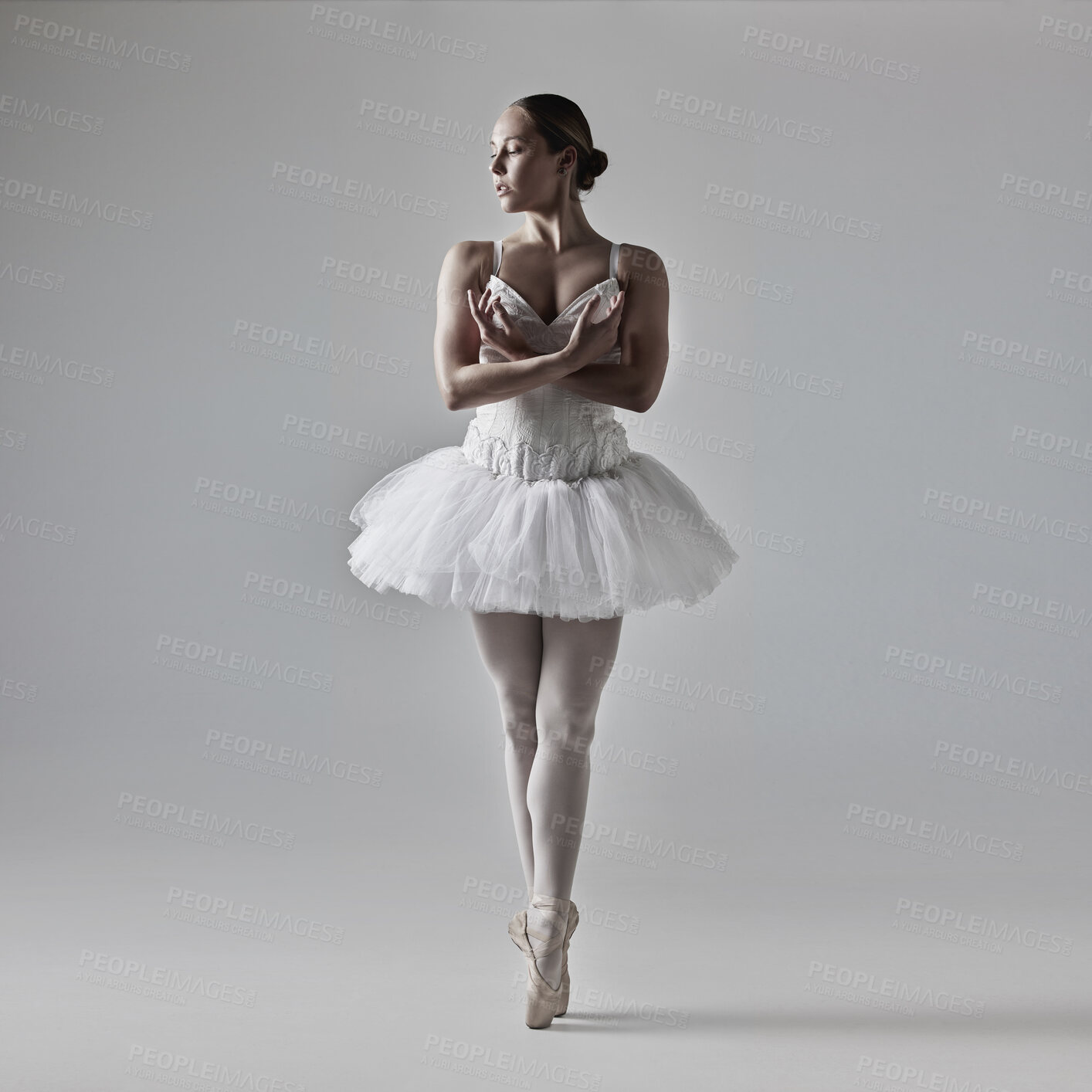 Buy stock photo Full of a beautiful young ballet dancer rehearsing in a dance studio