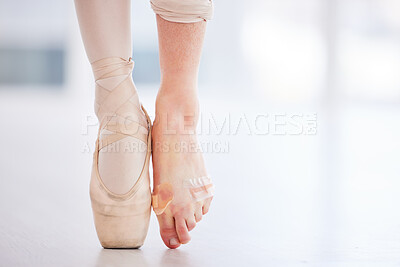 Buy stock photo Cropped shot of a young ballerina wearing a pointe shoe on one foot and band aids on her barefoot