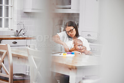 Buy stock photo Shot of a young mother on a call while holding her son at home