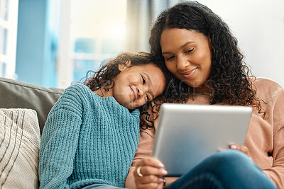 Buy stock photo Mom, girl and smile with tablet on sofa for streaming animation movies, bonding together and support in home. Mama, child and tech for watching online video with love, care and happy for learning app