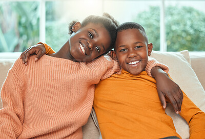 Buy stock photo Portrait of a brother and sister relaxing together on a sofa at home