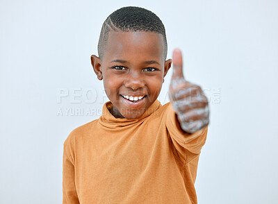 Buy stock photo Shot of a little boy showing a thumbs up after washing his hands at home