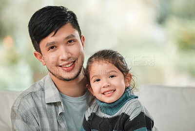 Buy stock photo Portrait of a young father and daughter bonding on the sofa at home