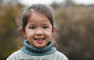 Buy stock photo Shot of an adorable little girl standing alone in the park