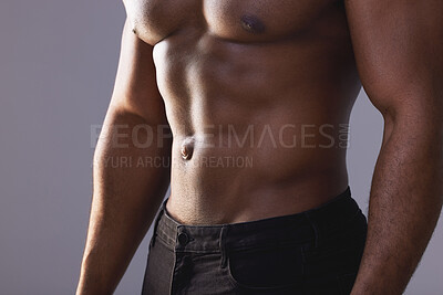 Buy stock photo Studio shot of an unrecognisable muscular man posing against a grey background