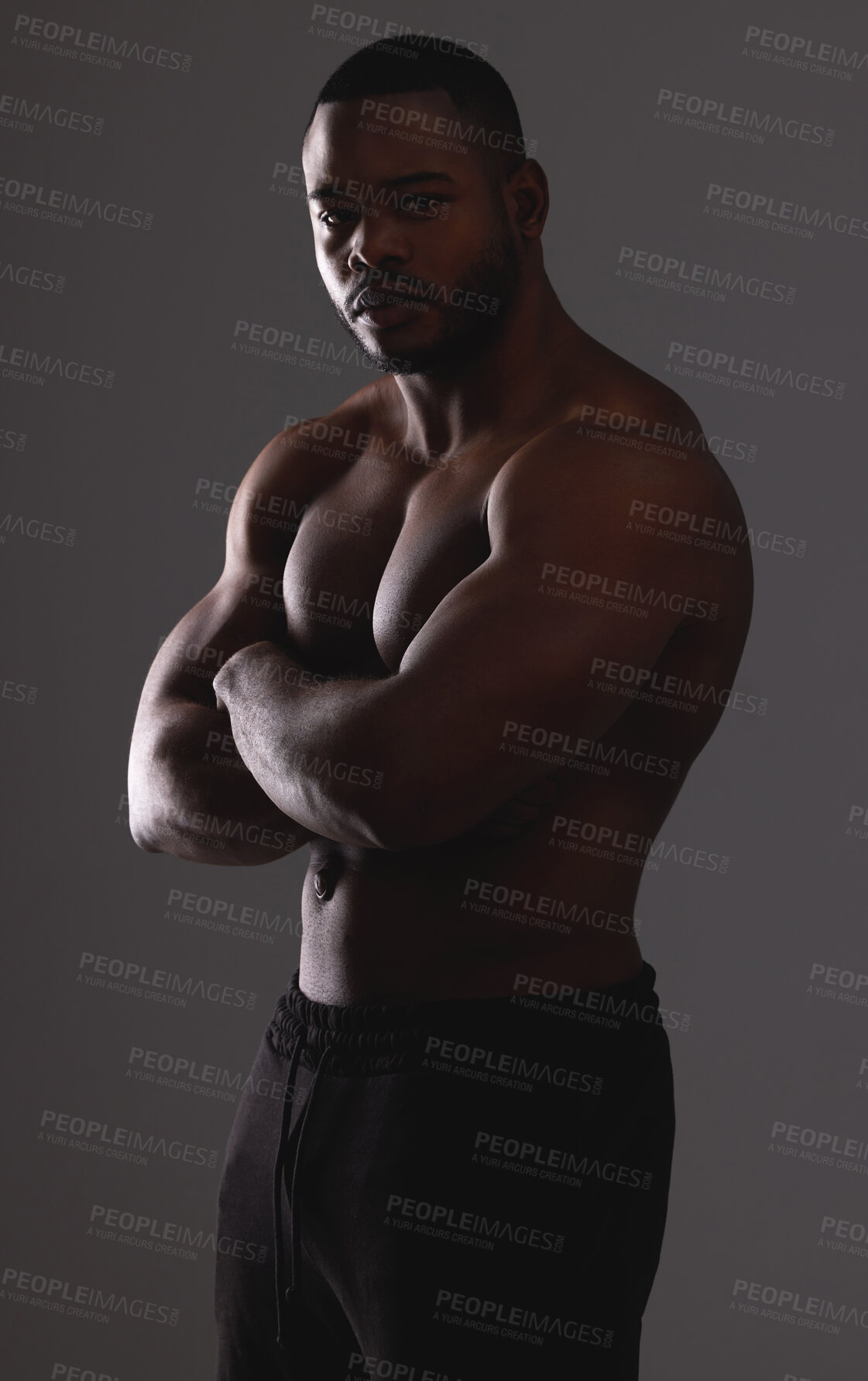 Buy stock photo Man, arms crossed and muscle in studio for fitness results, body builder and strong on gray background. Male person, flex and athlete for power of shirtless skin, exercise and topless for workout