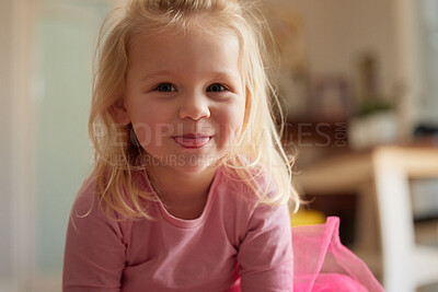Buy stock photo Shot of an adorable little girl sticking her tongue out