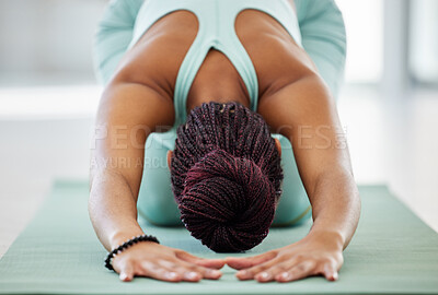 Buy stock photo Shot of an unrecognisable woman practising yoga in the studio and holding a child's pose