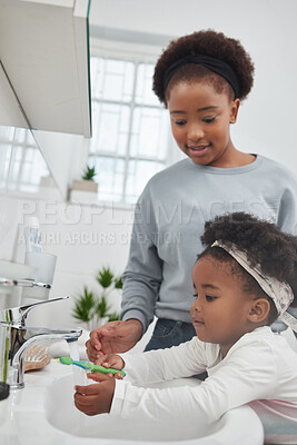 Buy stock photo Mother, toddler and washing of brush, bathroom and helping of baby with hygiene, smile and black family. House, pointing and woman with child with water, happiness and oral health of daughter