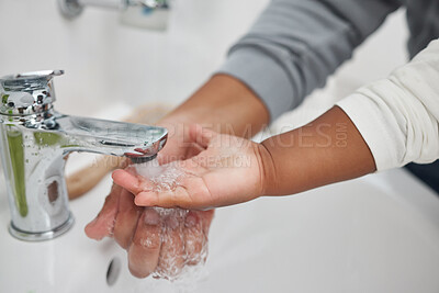 Buy stock photo Tap, washing and hands of toddler, water and teaching of child by mother in bathroom, cute and girl. Home, healthy and cleaning of bacteria, baby and together with mom, hygiene and routine in morning