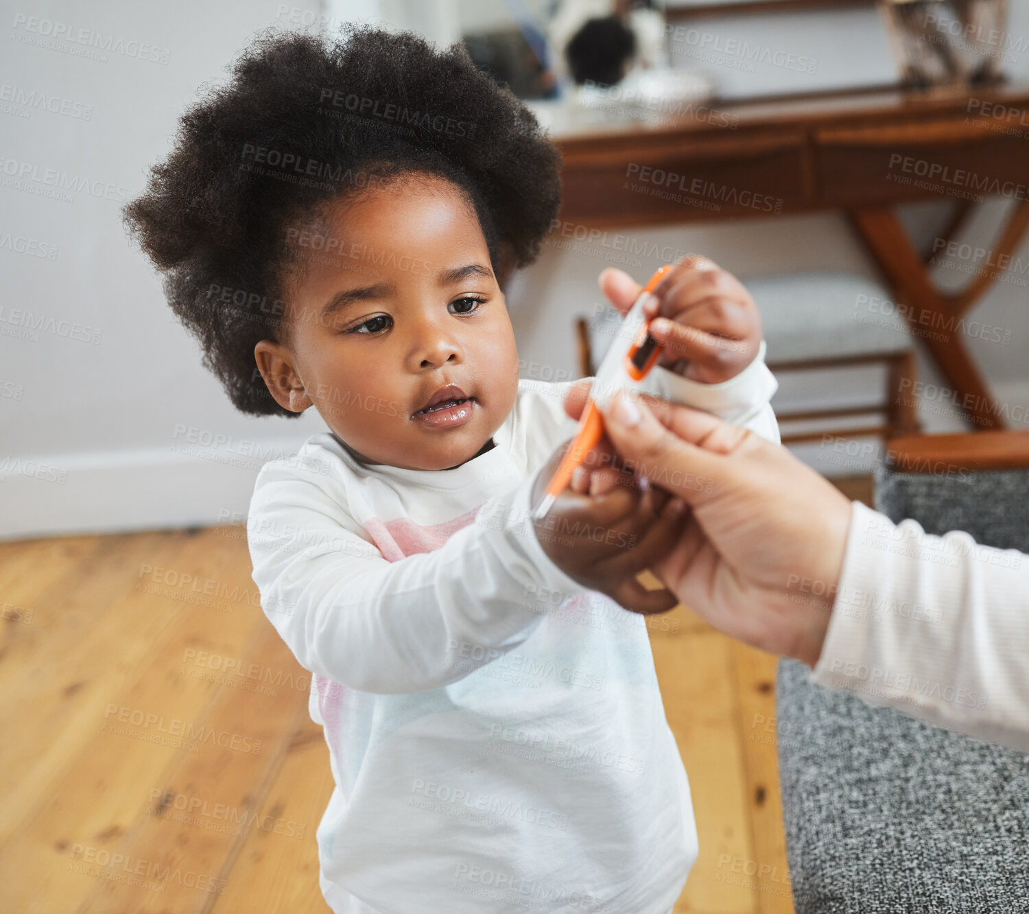 Buy stock photo Family, give and thermometer with girl child in living room of home for assistance, fever or help. Equipment, healthcare or medical with parent and African kid in apartment for illness or sickness