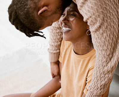 Buy stock photo Shot of a young couple relaxing at home
