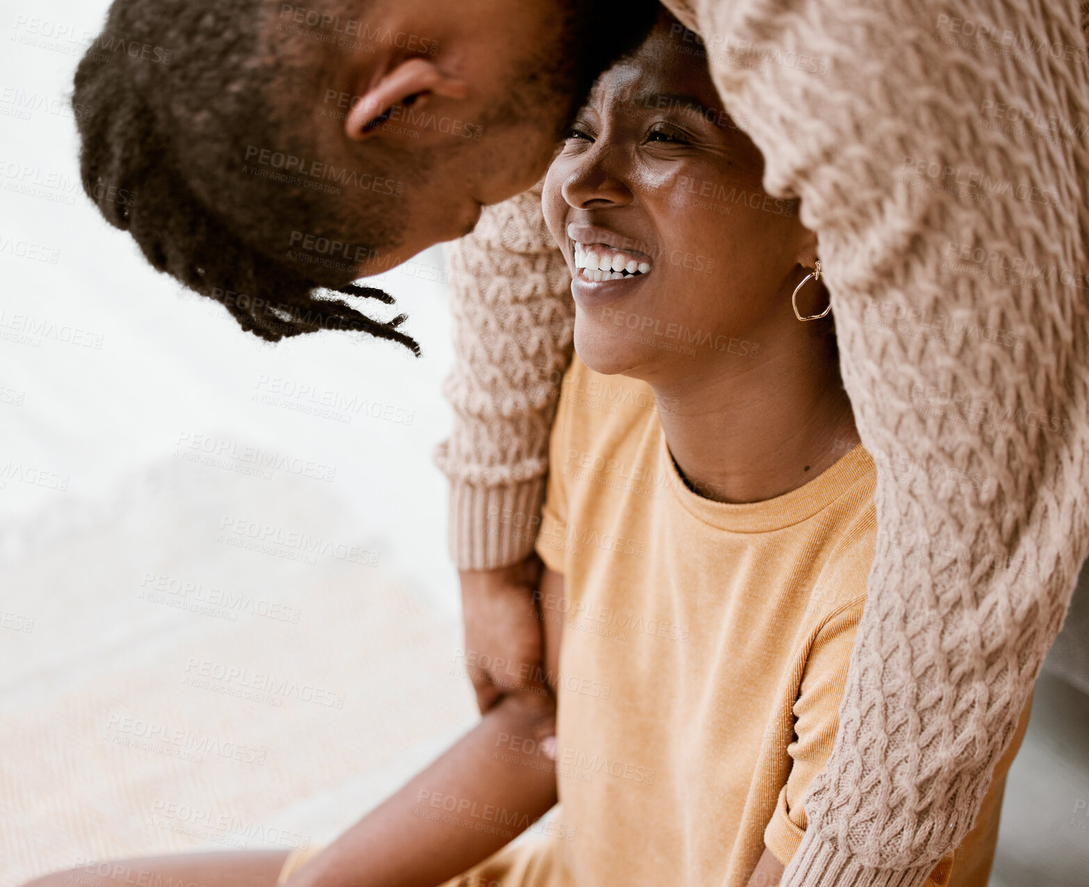 Buy stock photo Shot of a young couple relaxing at home