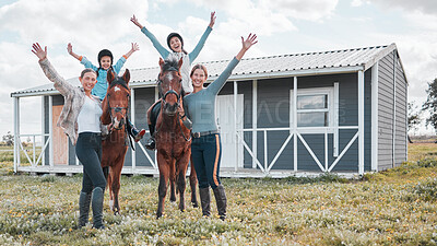 Buy stock photo Shot of two female instructors taking a woman and her daughter horse riding