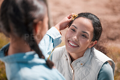 Buy stock photo Shot of a little girl and mother spending time together on a ranch