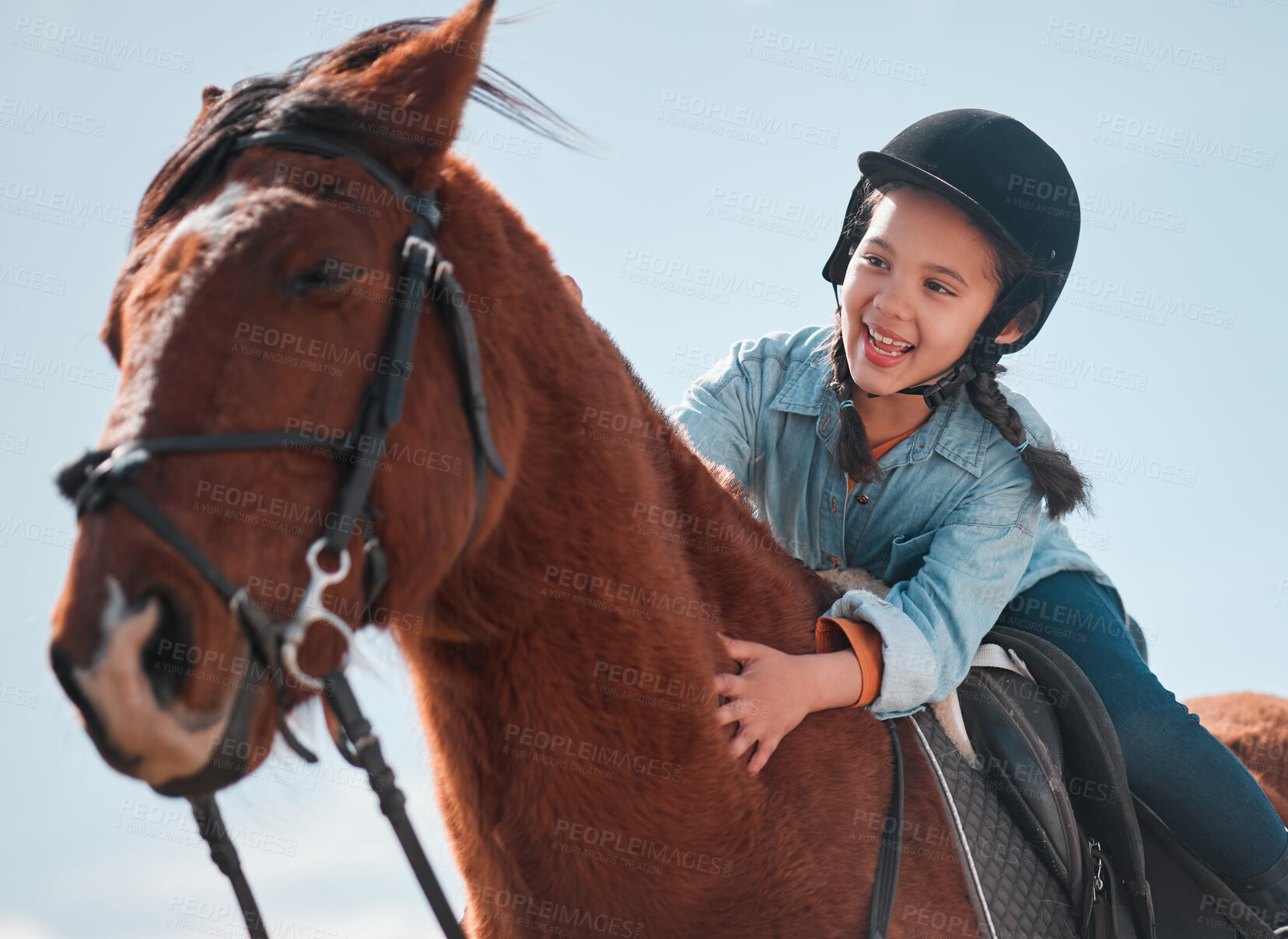 Buy stock photo Shot of an adorable little girl riding a horse
